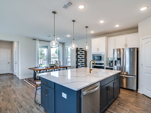 View of dining area from kitchen model representation