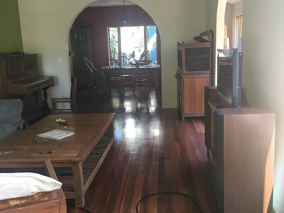 Cherry hardwood floors make this great room elegant while comfy on the feet, great family- friends meet up space or for shared media viewing