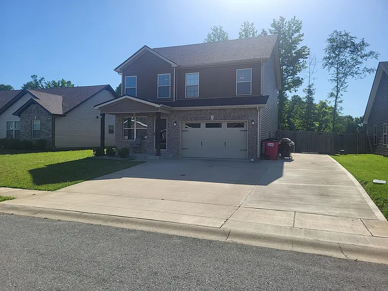 Expanded driveway for extra cars, boat, or storage.