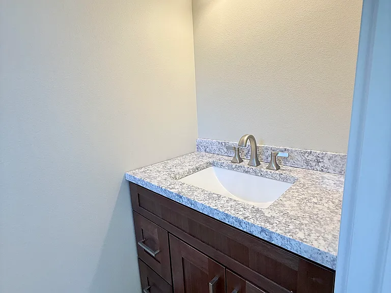 Ensuite bathroom in primary bedroom-mirror is installed now this was during construction