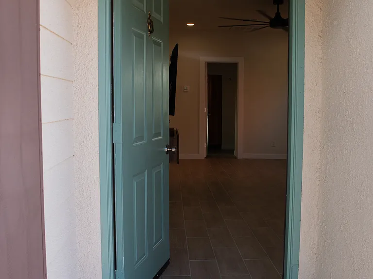 Front entrance leading to living room.