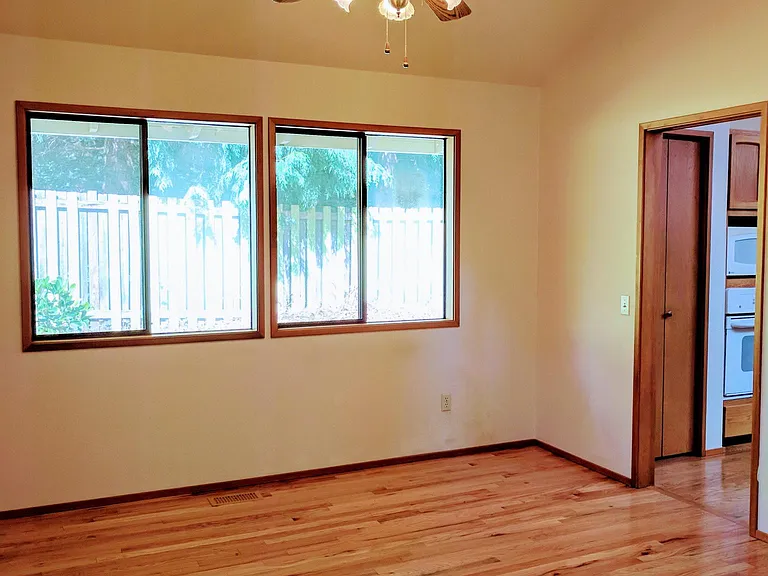 The formal dining room looks out to the beautiful garden.