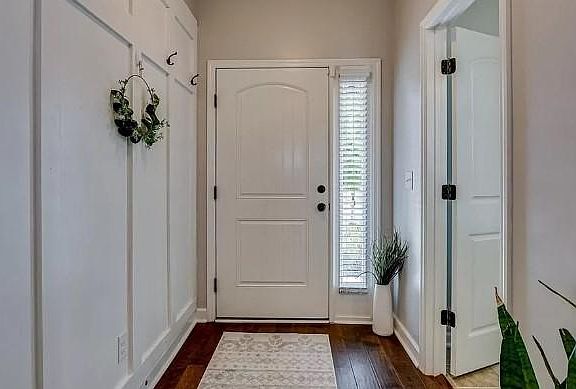 Front door hall with half bath