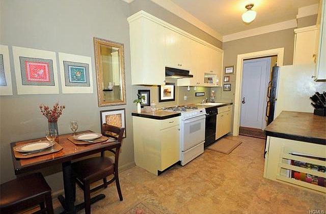 Eat-in-Kitchen has plenty of cabinets, including a pantry. and counter space.  Appliances include a dishwasher, range and refrigerator.