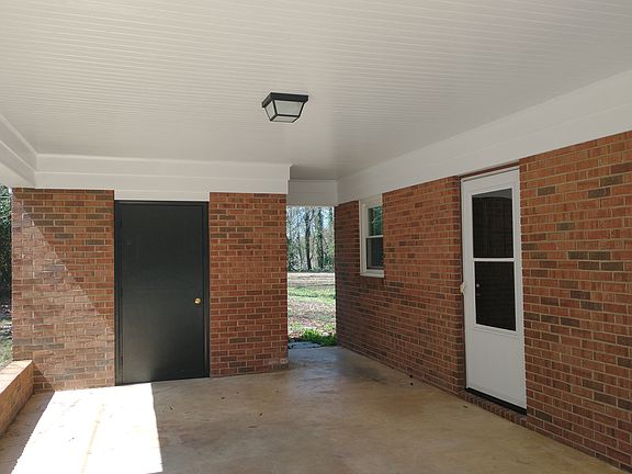 Carport with laundry/ storage room