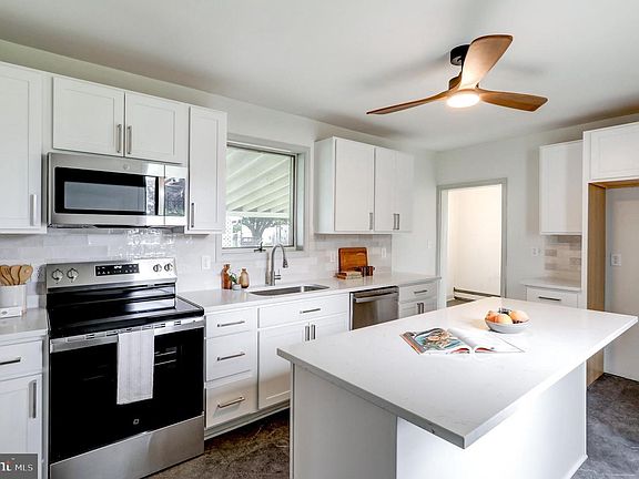 Updated kitchen - quartz counters, stainless steel appliances (refrigerator will be installed)
