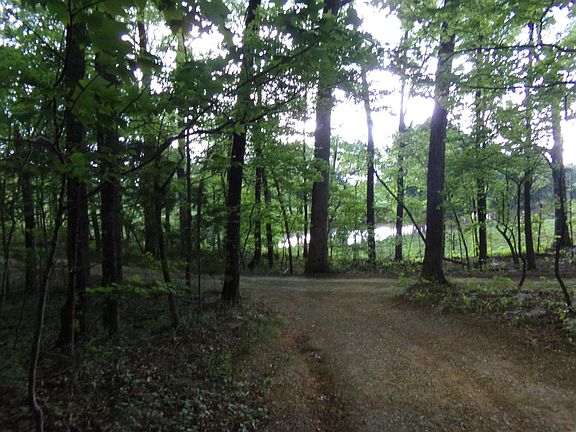 Private Downstairs Gravel Drive going out of the apartment area