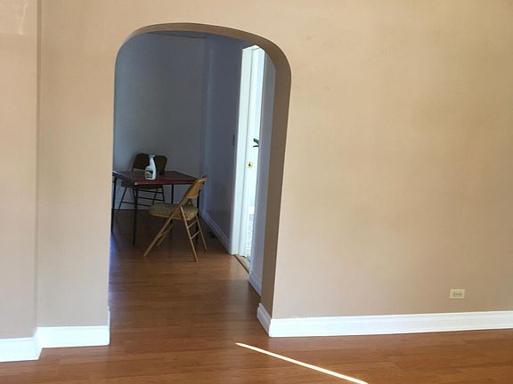 View from front door, opens into living room. Kitchen through archway, 2nd bedroom is directly to your left.