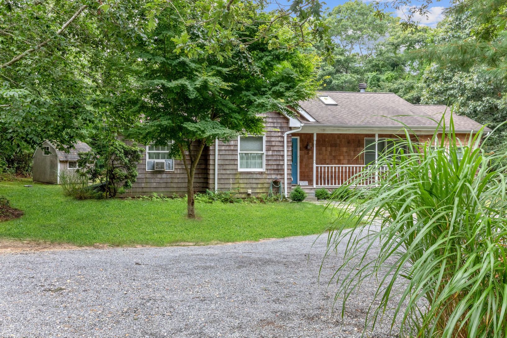  Front of house with mature yard and lots of shrubbery