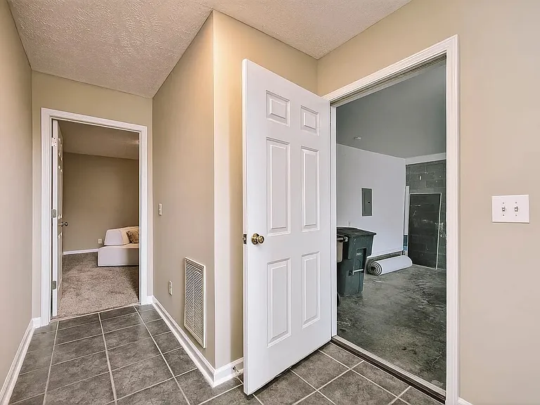 Downstairs by bonus room and garage