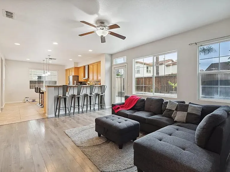 Open floor plan with Kitchen and backyard view