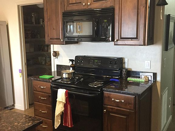Kitchen W/ Granite Counter tops and Large Pantry