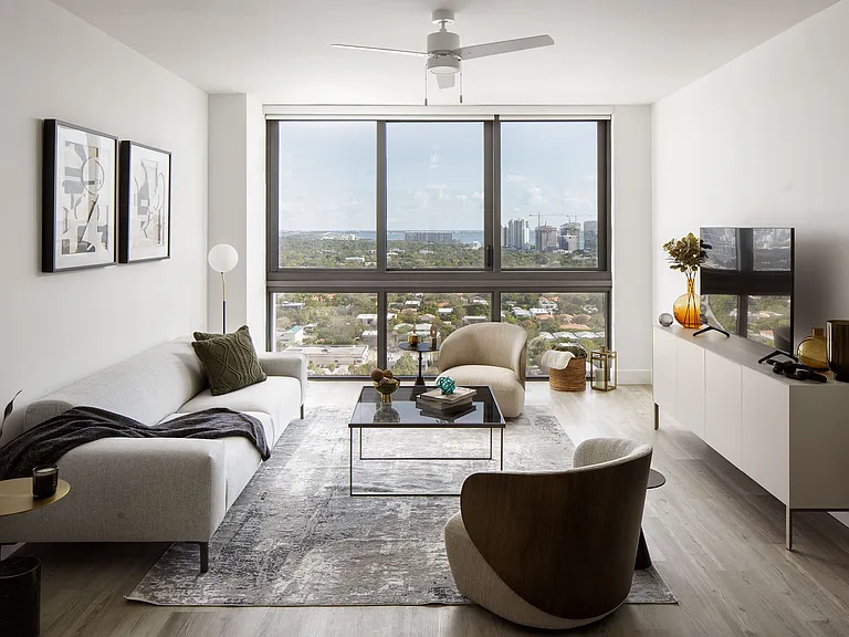 Residences include wood-look flooring and floor-to-ceiling windows