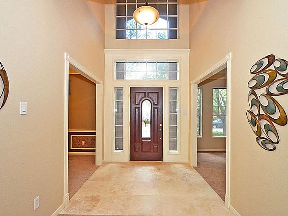 Two story entry welcomes family and friends in a grand way.
