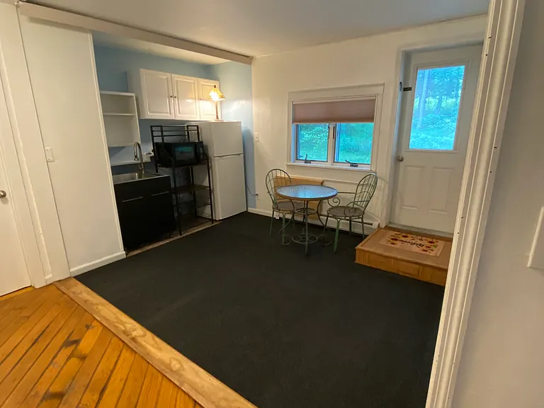 Living area, kitchen, and entryway