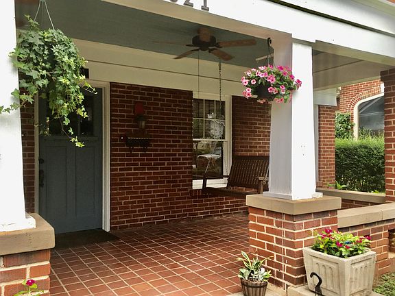 View of front porch and porch swing from driveway