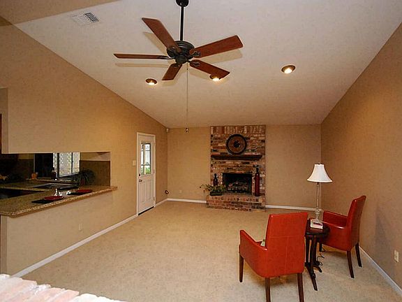 Large open 2 story den with gas log fireplace.
