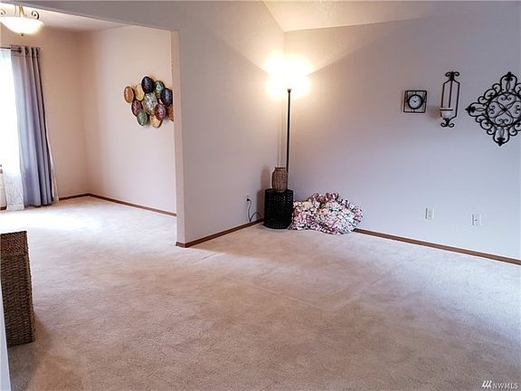 Another view of he living area as it opens up to the dining area.  This room could be used as an office/den.