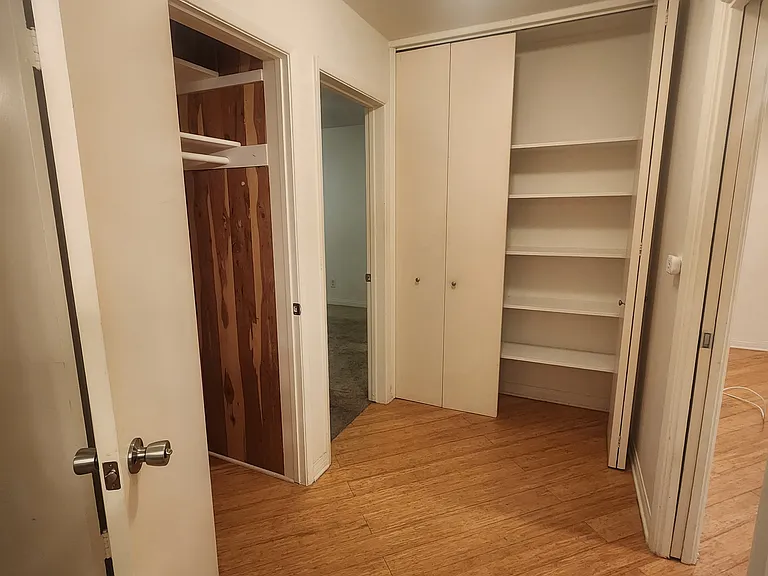 Hallway with two storage closets