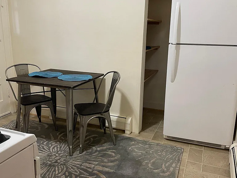 Eat-in table space and shelving (not shown) has been added. Refrig pocket with pantry storage.