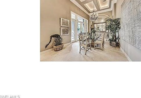 Waterfront Formal dining with screened lanai.