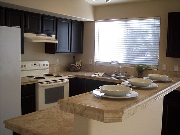 Remodeled Kitchen w/new sink, countertops, dishwasher, stained cabinets.