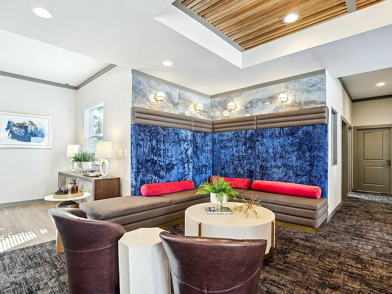 Relax in a cozy lounge area with vibrant seating and natural light at The Preserve Murfreesboro.