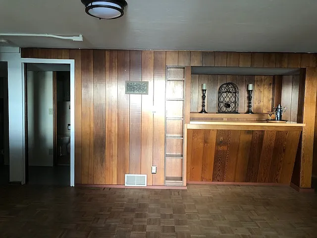 Shop and bathroom to the left, wet bar on the right