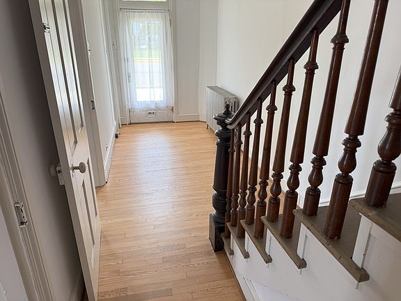 Front entry; big enough for a small office. Unused stairs to second floor. Lots of extra storage area.