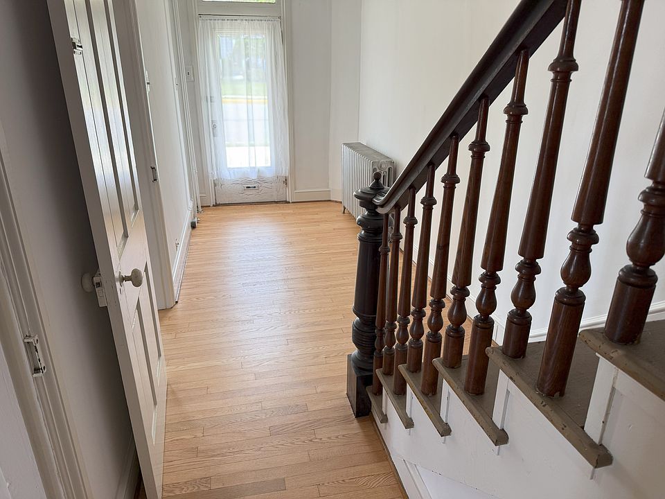 Front entry; big enough for a small office. Unused stairs to second floor. Lots of extra storage area.
