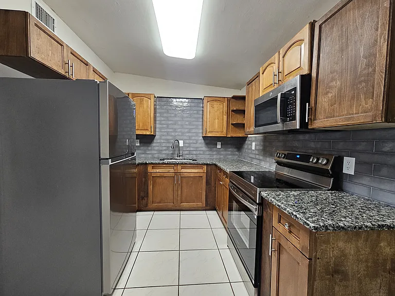 Kitchen New Stainless Steel Appliances and Garbage Disposal
