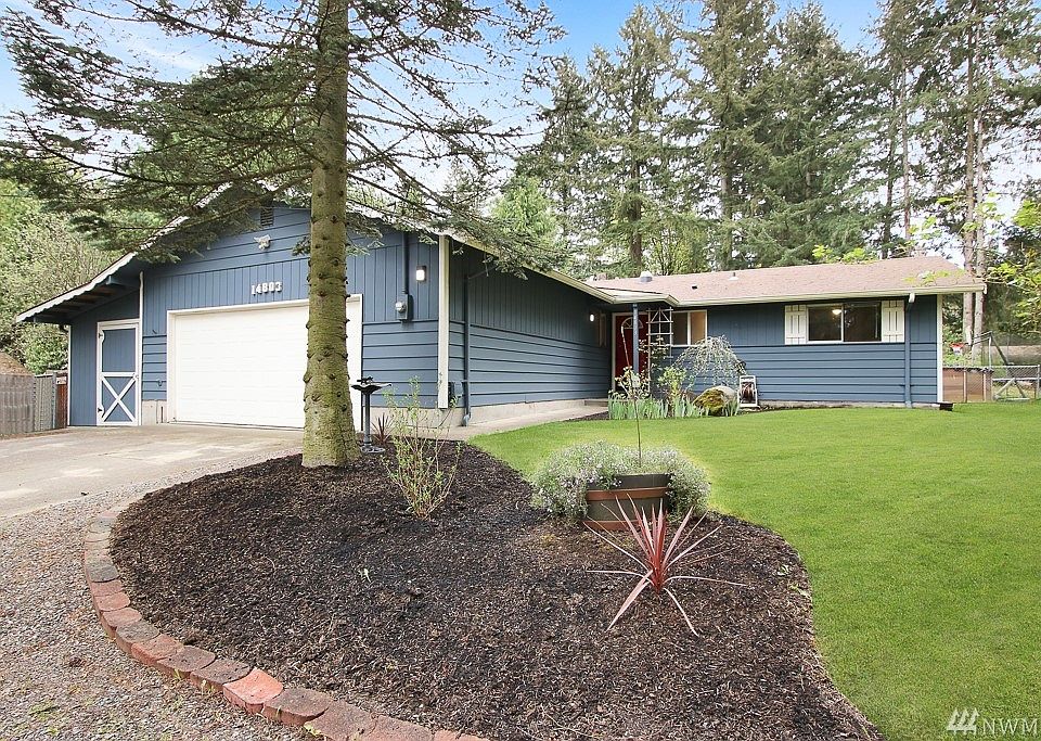 Lovely 1-story home on incredibly private shy 1/2 acre.