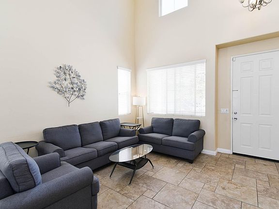 The living room with 2 floor high ceiling.