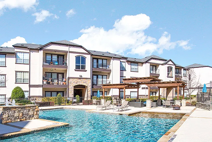 Beautiful pool and lounge area with pergola and seating. Soak in the sun!