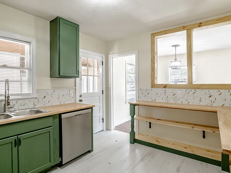 Kitchen with side entrance from covered carport