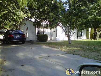 Driveway view of home and car garage