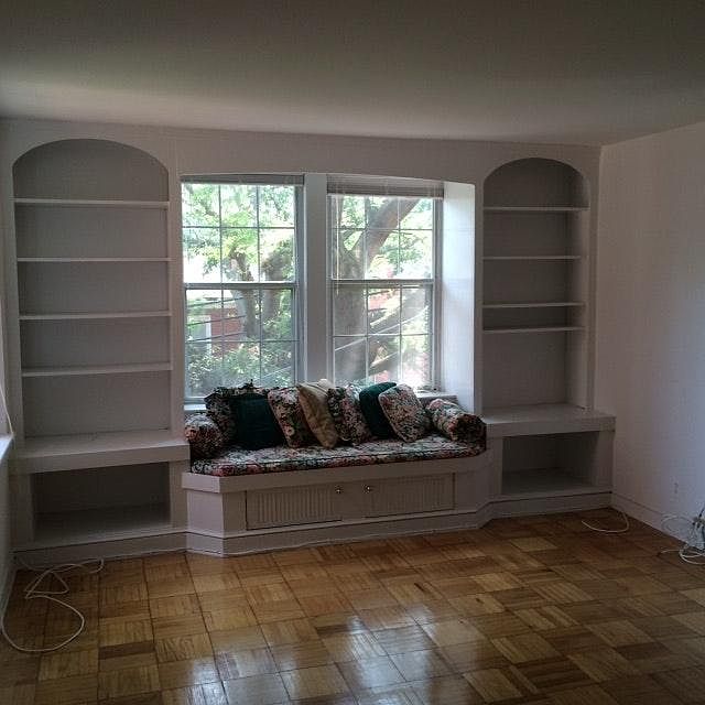 beautiful built-in windowseat and bookshelves