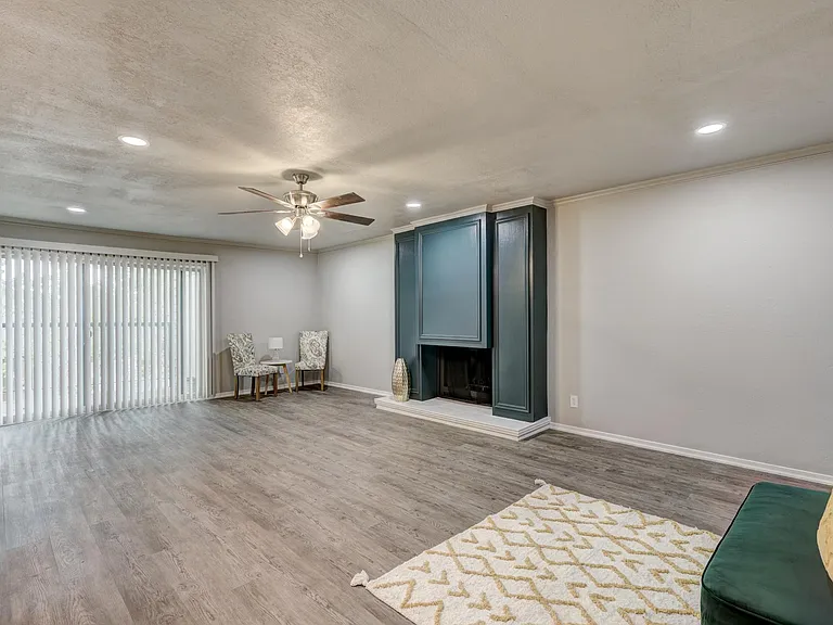 Huge living room with wet bar and patio access.
