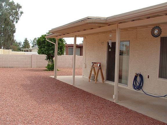 Covered porch & orange tree
