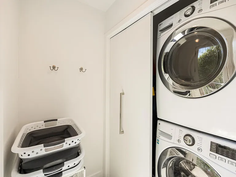 Dedicated laundry room equipped with a modern washer and dryer.