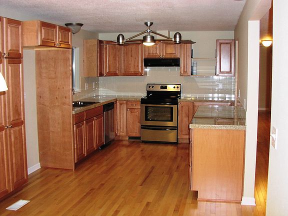 Hardwood Floors, Granite Counters, Maple Cabinets