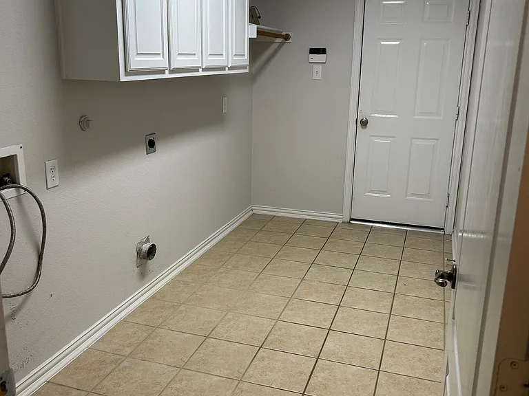 Huge laundry room with drip dry area.