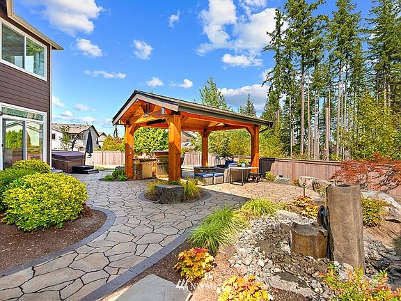 This backyard oasis with water feature is a dream come true.