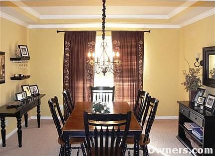 Formal dining room with crown molding