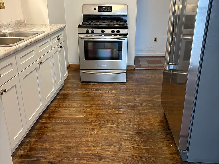 Kitchen view from glass patio doors/kitchenette.