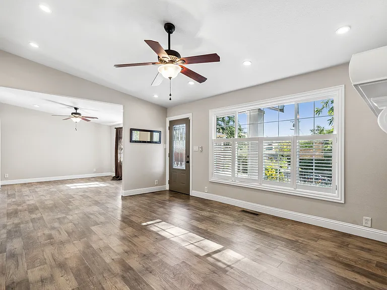 Dining area (foreground), living room (background)