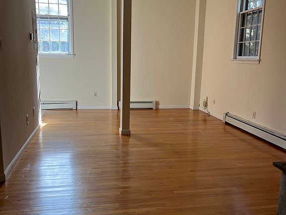 Living room with fire place and high ceiling (Continued)