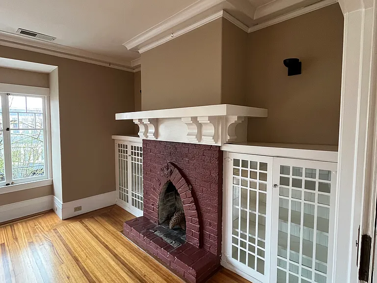 Living room fireplace (not for wood fires) and built in cabinets
