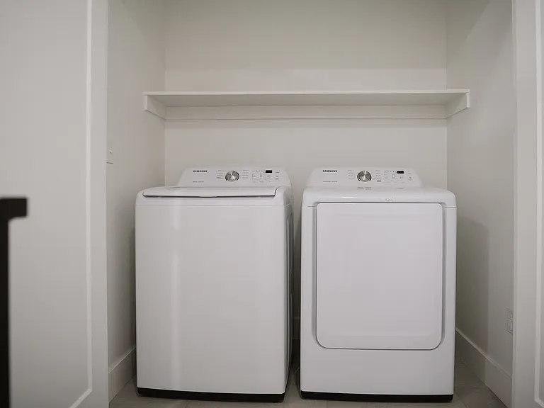new washer and dryer next to master