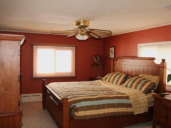 Master bedroom with crown molding, two closets and a private full bath.